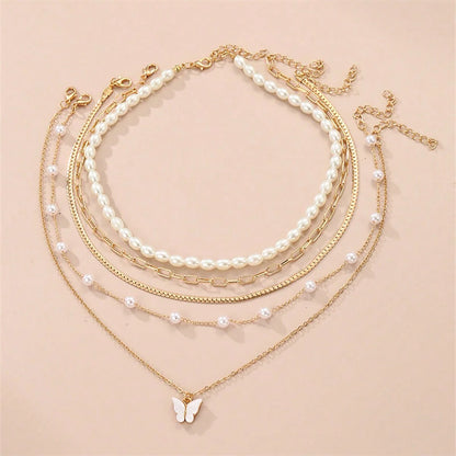Conjunto simples de colar de pingentes de pérolas e borboletas, design high-end, adequado para uso diário e pendulares, 5 peças por conjunto, Colares femininos elegantes,
Conjunto de joias com borboletas,
Colar de pérolas clássico,
Joias femininas delicadas,
Colares com pingentes para presente,
Conjunto de colares dourados,
