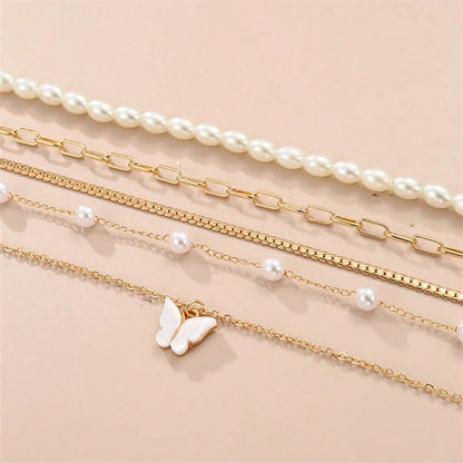 Conjunto simples de colar de pingentes de pérolas e borboletas, design high-end, adequado para uso diário e pendulares, 5 peças por conjunto, Colares femininos elegantes,
Conjunto de joias com borboletas,
Colar de pérolas clássico,
Joias femininas delicadas,
Colares com pingentes para presente,
Conjunto de colares dourados,
